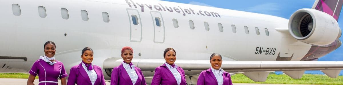ValueJet cabin crew in front of a ValueJet aircraft